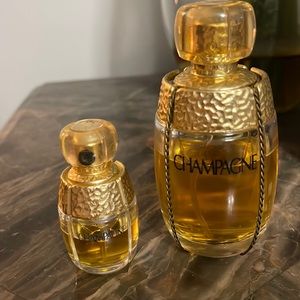 Yves Saint Laurent 2 bottles Champagne eu de toilette both partially full.